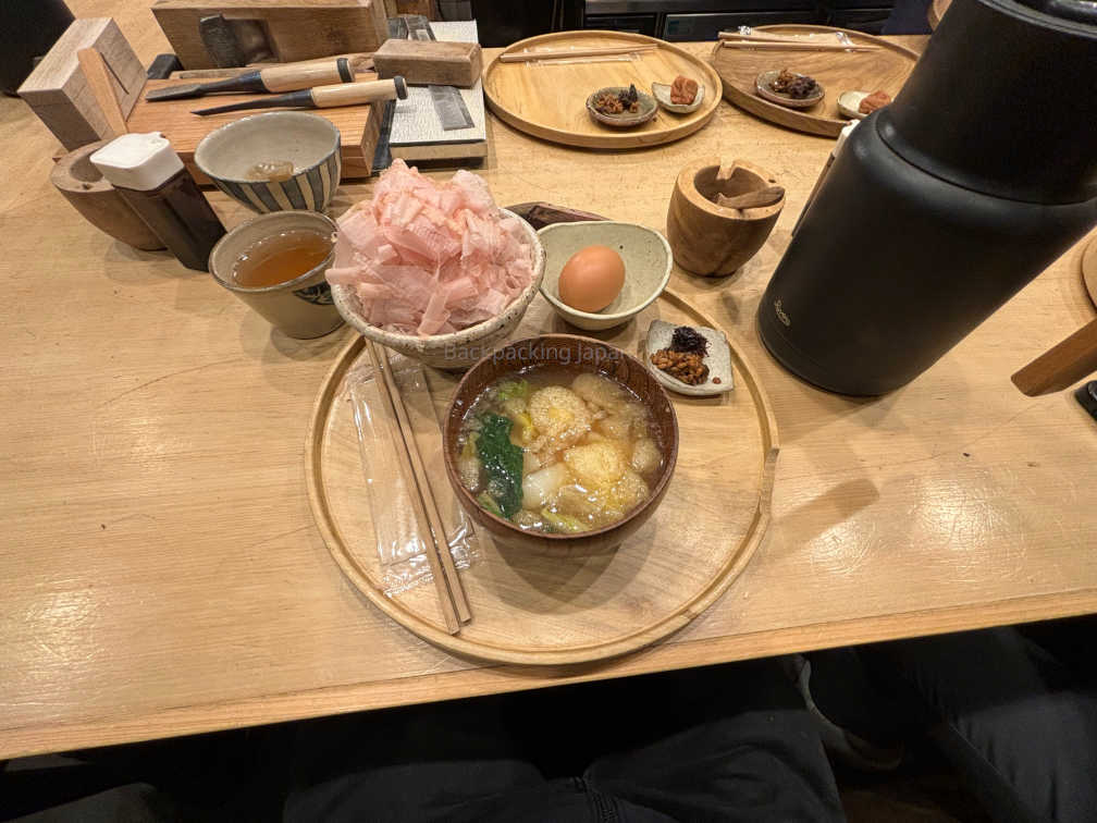 Katsuobushi, breakfast consisting of bonito flakes on rice, with a raw egg and miso soup